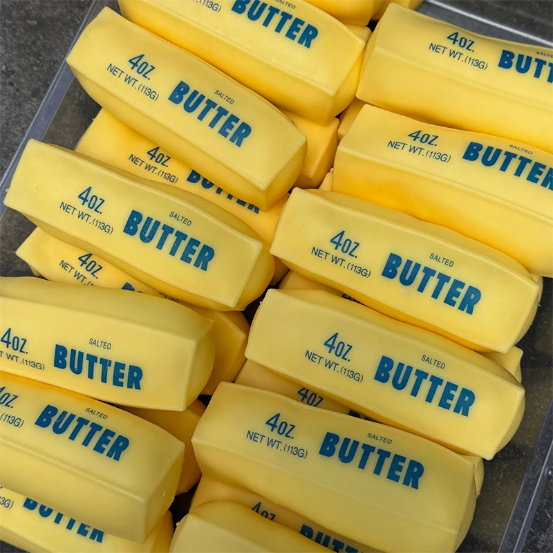 Butter-Stick-Quetschball, Stre – Novelty Gifts Bewertung und Preis